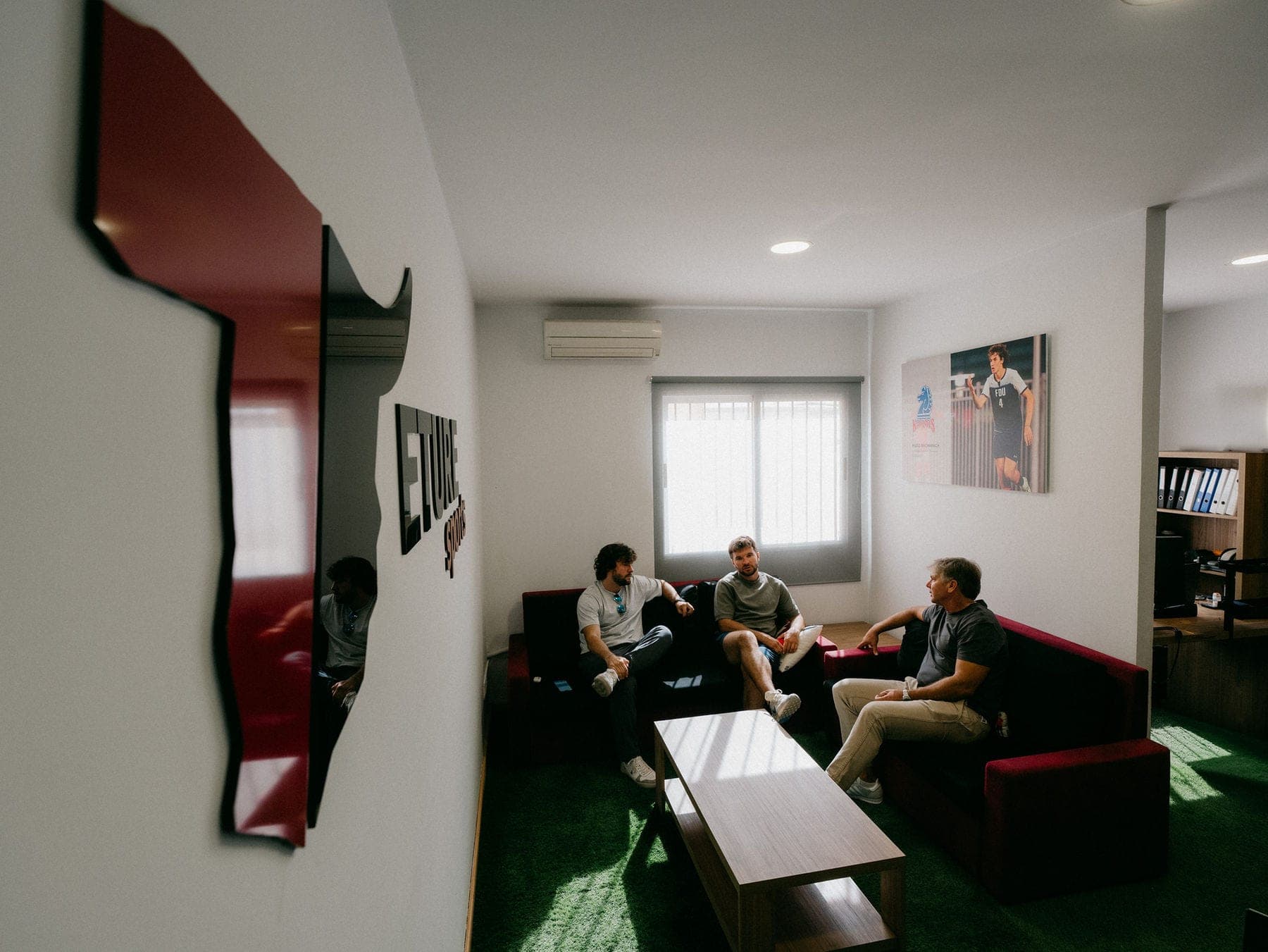 Eture Sports directors talking in the Valencia office