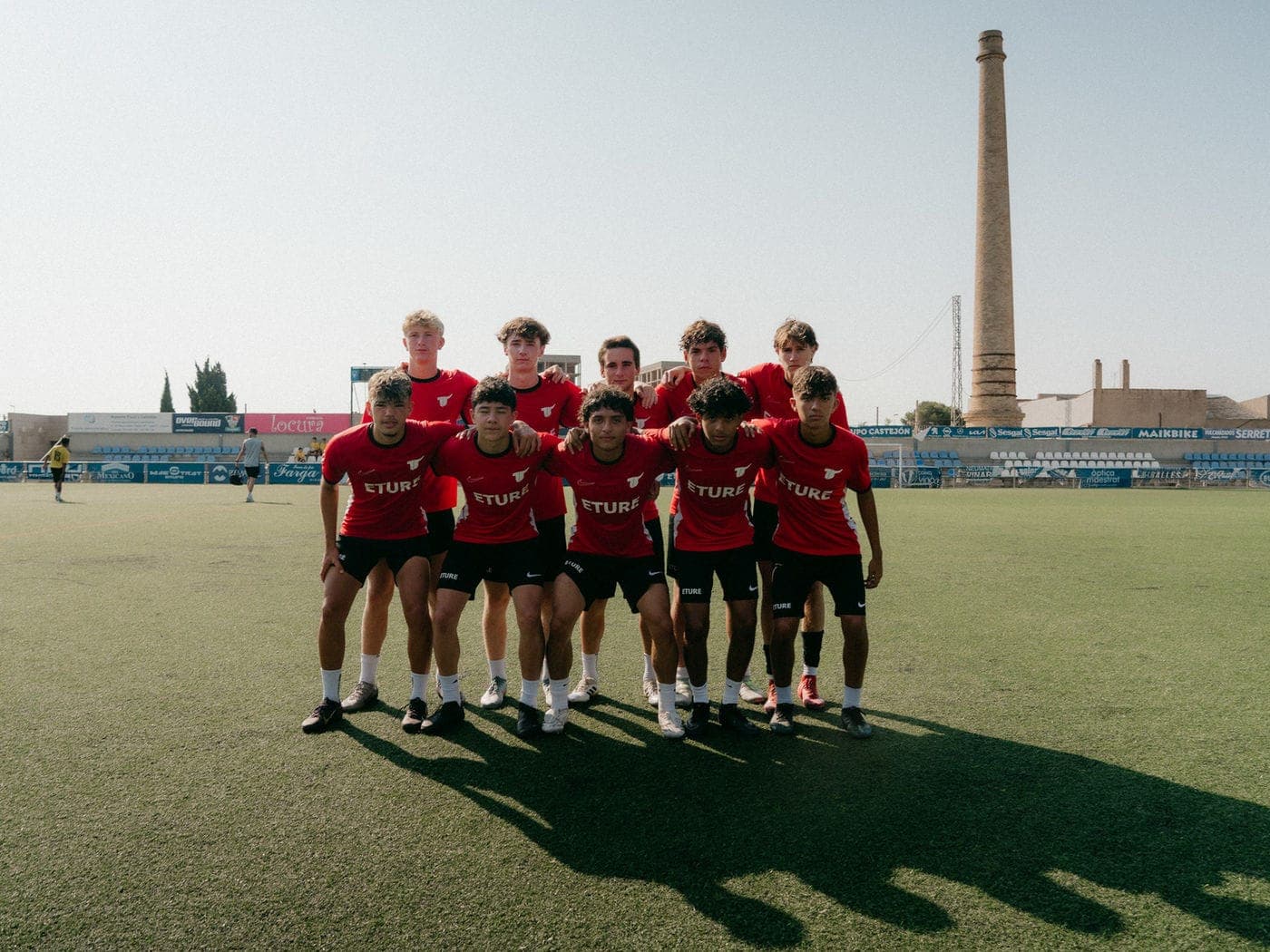 The camp squad in a huddle at the Vinaròs stadium
