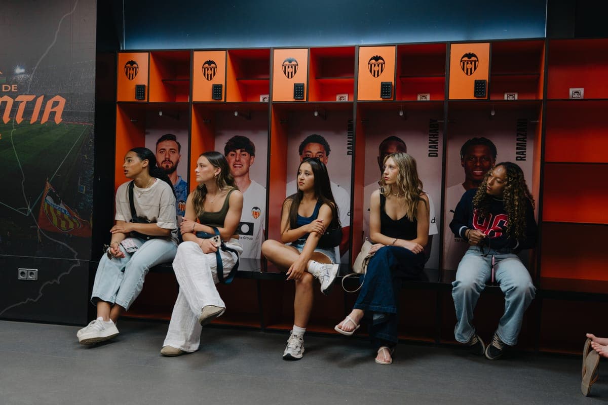 The group in the home dressing room on a stadium tour
