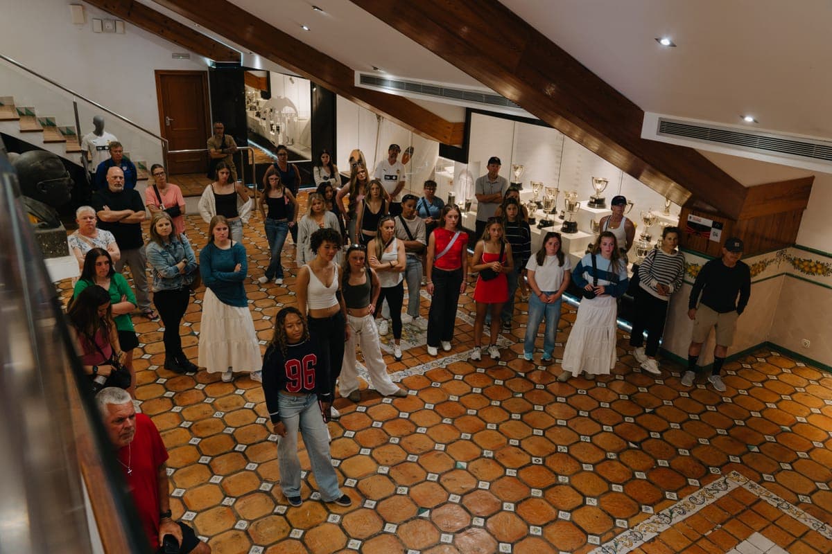 The group in the trophy room on a stadium tour