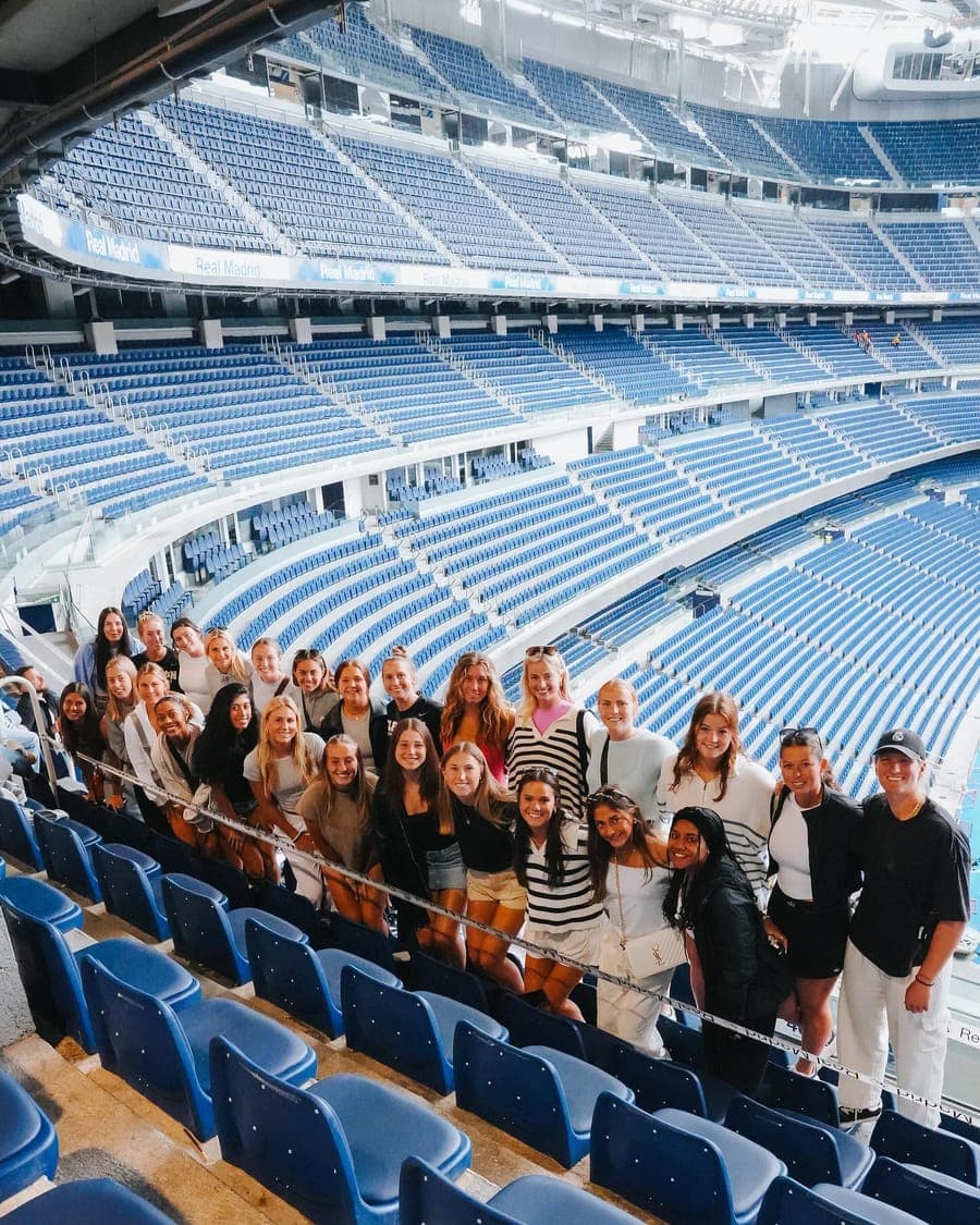 The group in the stands on a stadium tour