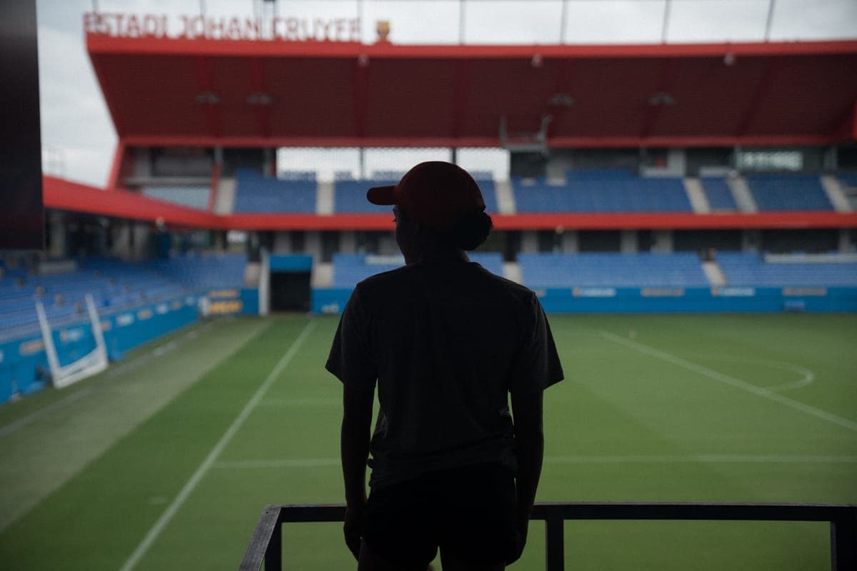 A player looking out over an empty stadium