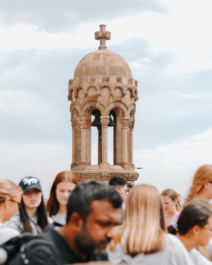 A bell tower above the crowd in the old town