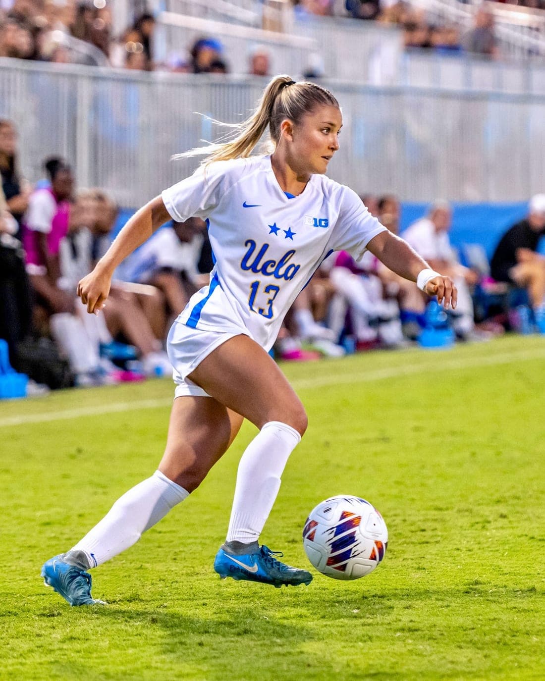 A player in NCAA colours on the ball
