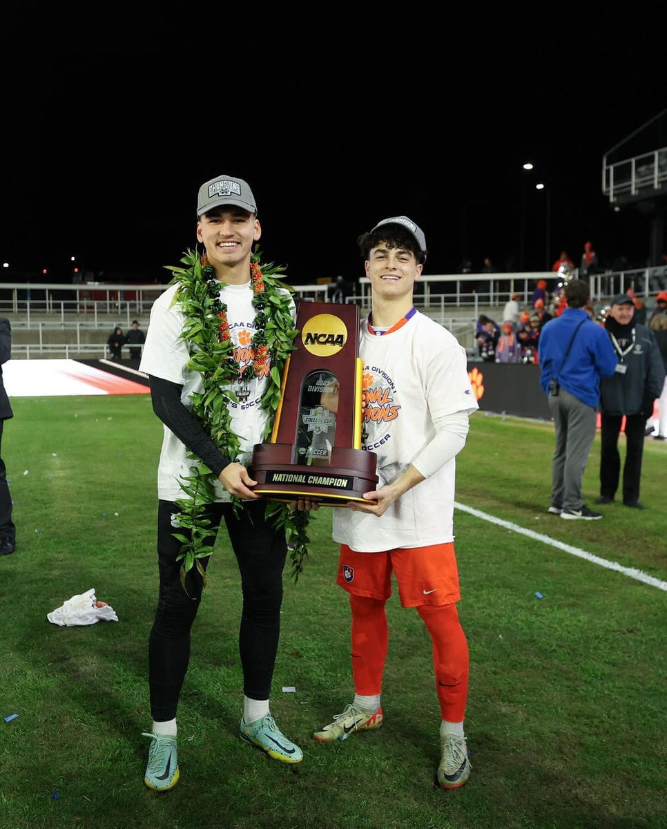 Isaiah Easley holding the NCAA national championship trophy with Clemson, December 2023